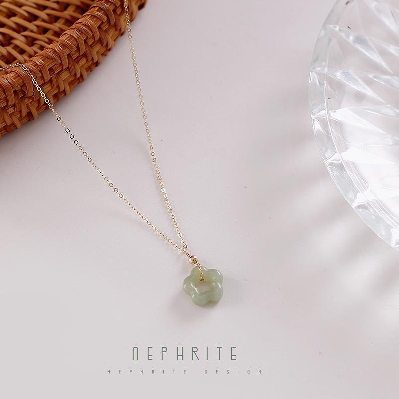 Hetian Jade Blossom Pendant Necklace — worn on the wrist