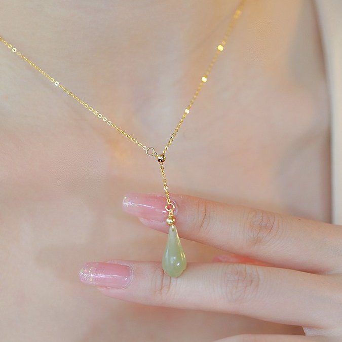 Hetian Jade Magnolia Drop Necklace — worn on the wrist