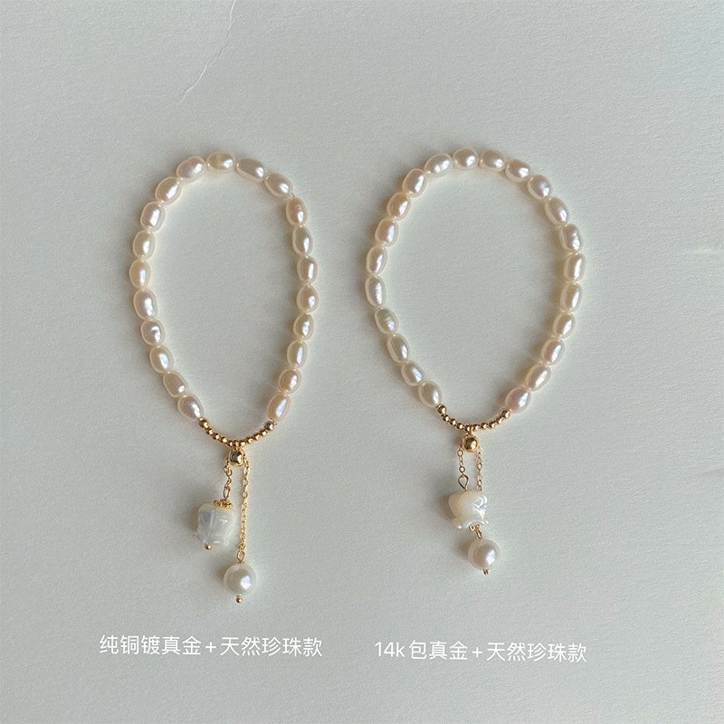 Freshwater Pearl & Lily Charm Bracelet — worn on the wrist