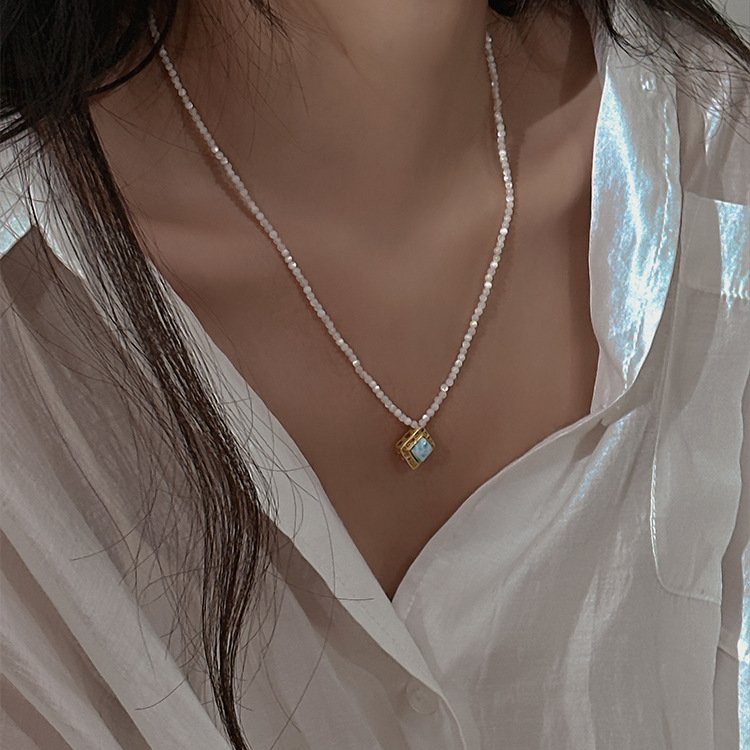 White Butterfly Shell Strand Necklace — close-up bead detail